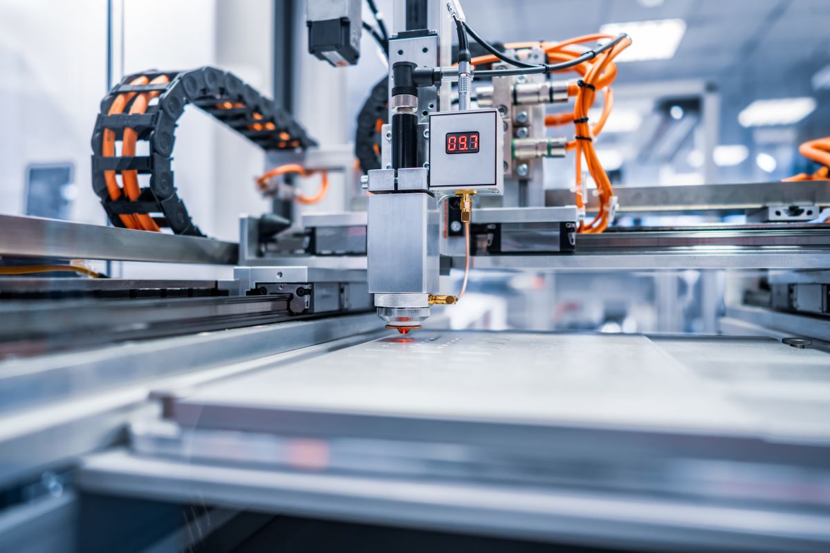 CNC Laser cutting of metal, modern industrial technology. Small depth of field. Warning - authentic shooting in challenging conditions.